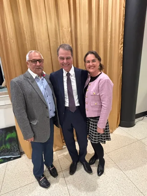Rick Champagne with community members at a local event
